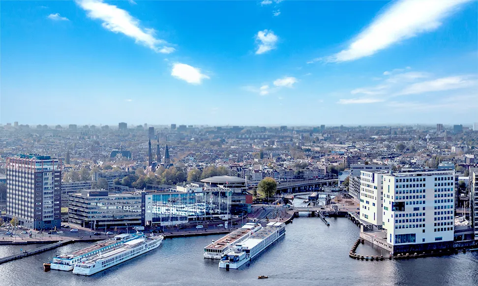 An aerial photo of modern Amsterdam with towering buildings